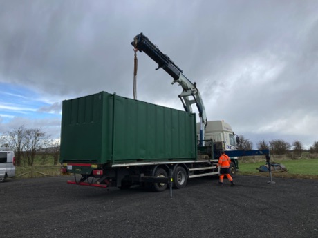 The clubhouse being lifted off its trailer