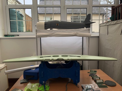 Wing and fuselage, the latter still in grey primer